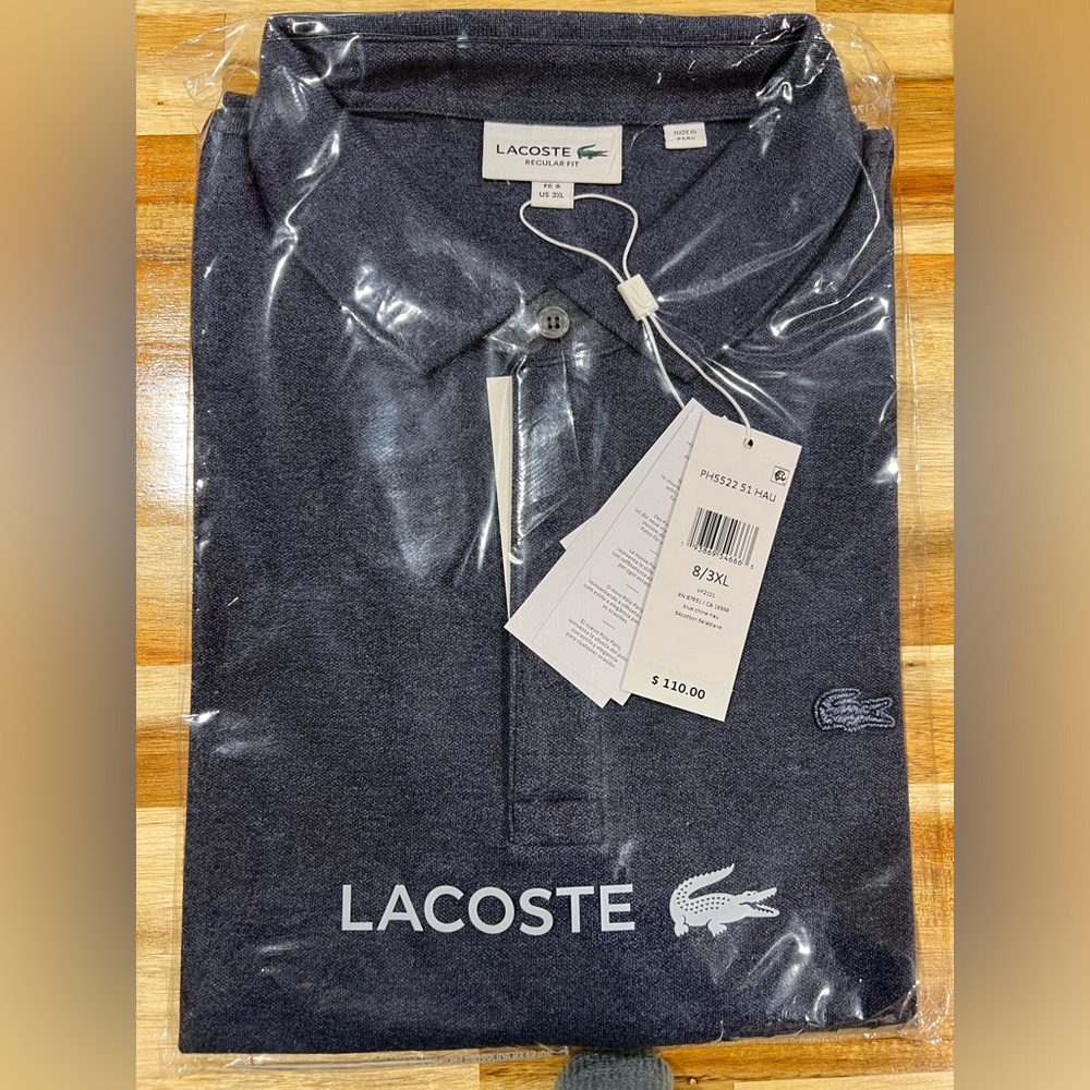 Still in clear bag. Men’s short sleeve Lacoste polo. Size 8 (3XL)